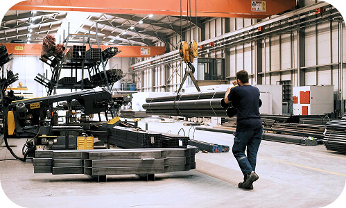 Kiwi employee working inside manufacturing facility