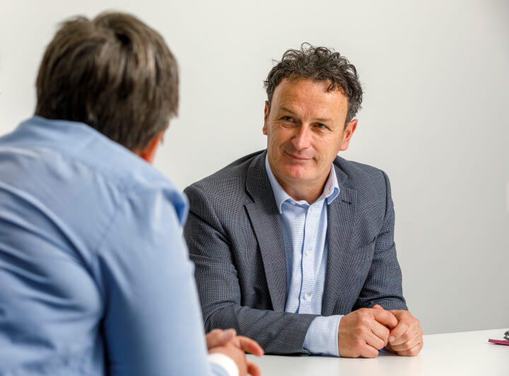 Steve Kennedy, Principal Consultant at EQ Consultants, advising a client on organisational change strategy during a business meeting